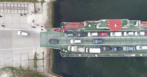 top down view of ferryboat transferring cars. Ferry transfers cars and passengers to the other side

