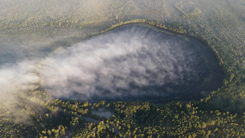 Morning over the forest lake view from the unmanned aerial vehicle