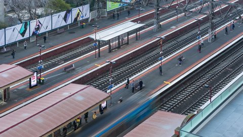 Melbourne , Victoria , Australia - 06 18 2018: MELBOURNE, AUSTRALIA - JUNE 19, 2018: Time lapse from above of trains and commuters at South Yarra railway station during morning rush hour