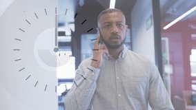 Animation of clock over african american businessman talking on smartphone. global networks, business, data processing and digital interface concept digitally generated video.