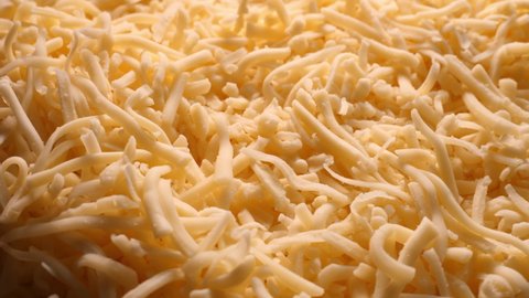 Grated pizza cheese, close up
