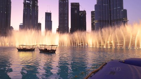 The Dubai fountain with traditional abra boats in the lake near Dubai Mall - Dubai, UAE - Sep '21