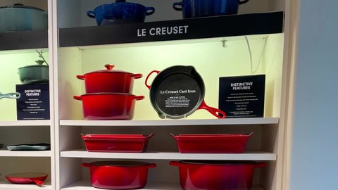 Orlando, FL USA - September 9, 2021:  Panning right on the Le Creuset display at a Williams Sonoma  retail store sign at a mall in Orlando, Florida.