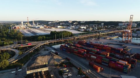 Gdynia, Poland, September 2021: Modern Port of Gdynia aerial view. Cargo containers ship loading and unloading in deep sea port. Baltic Container Terminal. View of thousands of shipping containers