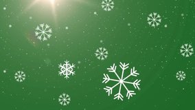 Animation of falling snow flakes on green background. christmas, tradition and celebration concept digitally generated video.