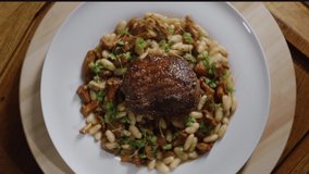 F Top View of Food Video Concept Slow motion. White Plate with delicious Beef Food dish. Food Preparation Footage.