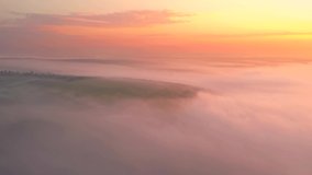 Drone flying over a fantastic ocean of fresh clouds at sunrise. Cinematic aerial shot. Location place Dniester river, Ukraine, Europe. Discover the beauty of earth. Filmed in 4k, drone video.