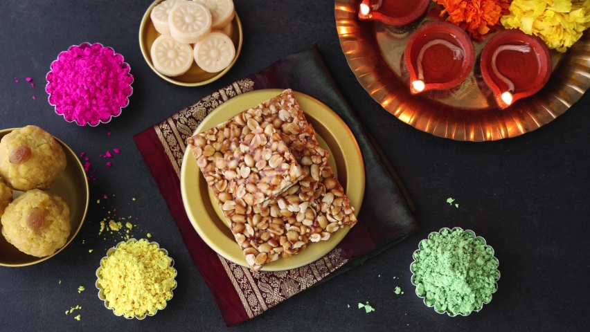 Peanut chikki candy gajak Indian sweet food specially made for festivals of India like Diwali Dussehra Holi ganesh chaturthi Ram navami Durga pooja, durga ashtami Navratri. Royalty-Free Stock Footage #1079669771