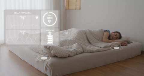 Asia woman sleep on bed sensor checking sleep cycle, graph ECG data, pulse rate, brain wave chart or body blood control from IOT bed smart detect STEM life at home. Deep nap scan relax rest in AR app.
