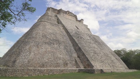 UXMAL, YUCATAN, MEXICO - CIRCA 2021: Piramide del adivino also known as the Pyramid of the Magician, the central landmark of ancient Mayan city of Uxmal