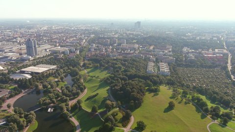 MUNICH, GERMANY, EUROPE - CIRCA 2020: Aerial view of BMW Group Plant Munich (luxury car manufacturer) with BMW Museum and BMW Headquarters buildings next to park Olympiapark.