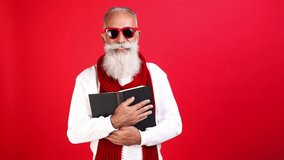 Clever santa claus read fairy tail story x-mas carol embrace textbook - Powered by Shutterstock - Get 15% off with code: PIKWIZARD15