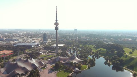 MUNICH, GERMANY, EUROPE - CIRCA 2020: Aerial view of capital city of Bavaria, The Olympic Tower Olympiaturm in park Olympiapark at sunrise.