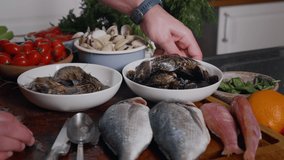 Cleaning Shells For Cooking. Various seafoods on chef kitchen. Tasty seafood food. Food preparation footage. Slow motion food video.