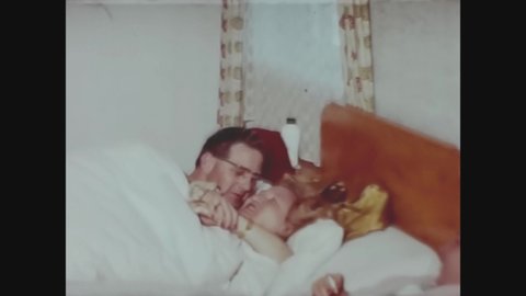 TYROL, AUSTRIA FEBRUARY 1964: Orgy of people in bed in 60's