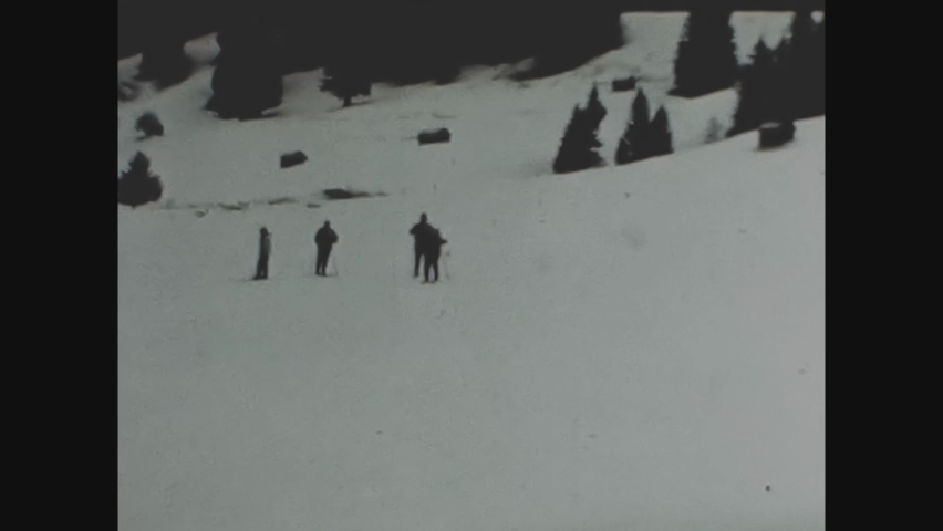TYROL, AUSTRIA FEBRUARY 1964: People skiing Tyrol in 60's