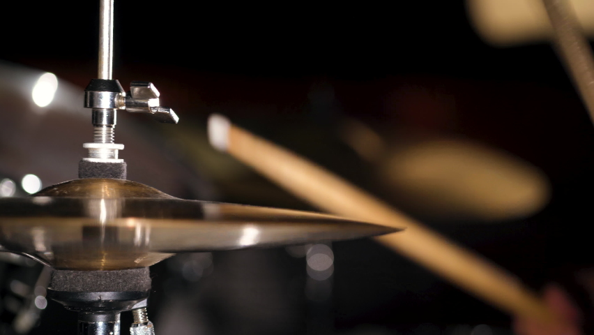 Hands of musician drummer holding drum sticks hitting on hi-hat cymbal Royalty-Free Stock Footage #1079704325