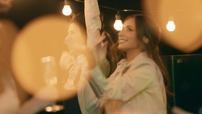 Happy and very excited people have a great night together on the rooftop of terrace dancing and feeling relaxed - Powered by Shutterstock - Get 15% off with code: PIKWIZARD15