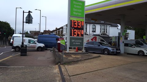 London. UK- 09.25.2021: a busy petrol station with queue of motorists refilling their cars in fear of fuel shortages due to lack of HGV drivers in the country.