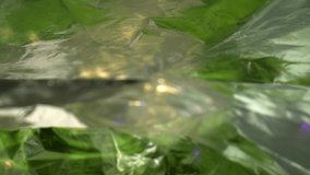 Pulling away from two layers of foil with both layersing slightly. Green textured colorful foil reflect showing the many contours, shapes, and texturing of the surfaces. - Powered by Shutterstock - Get 15% off with code: PIKWIZARD15