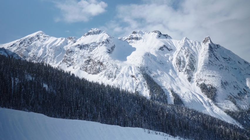 Grand mountains covered in snow of British Colombia, winter at Rogers Pass Royalty-Free Stock Footage #1079707508