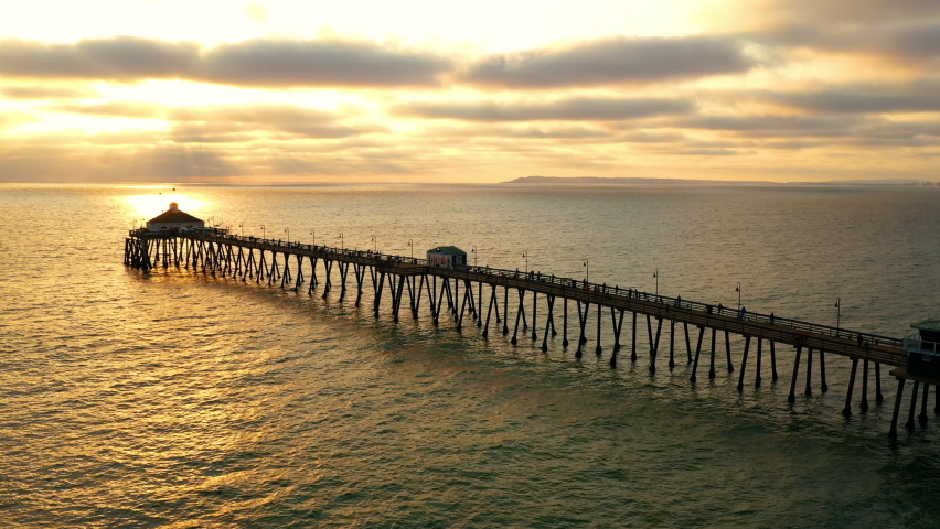 Imperial Beach Pier Silhouette Against Sunset Sky In San Diego, California, USA. - aerial Royalty-Free Stock Footage #1079707589