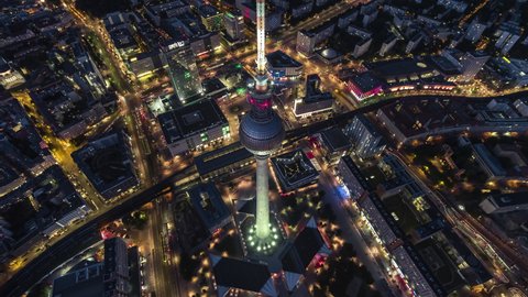 Berlin, Germany - circa 2021: Establishing Aerial View Shot of Berlin, Germany, Alexanderplatz, Mitte, narrow down view, night evening