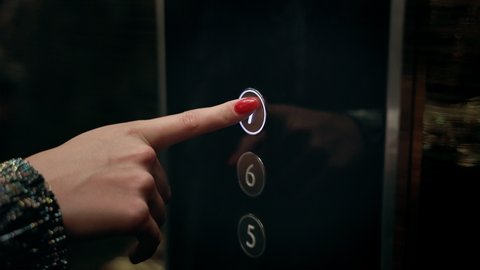 Girl With Manicure Presses Elevator Button.