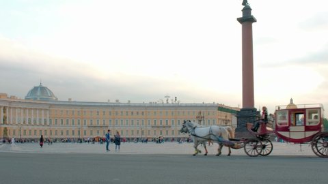 Saint Petersburg, Russia - September 11, 2021: Russia, St. Petersburg, Palace Square, Alexander Column, retro horse carriage and tourists. Editorial.