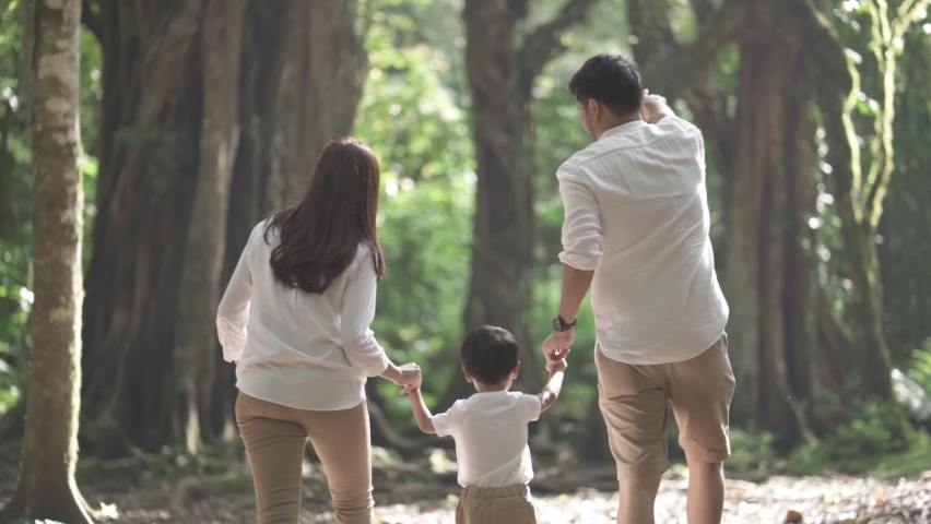 Portrait of Small and Happy Asian Family Enjoying Activities at The Botanical Garden Park Jungle - Father, Mother and Child in Slow Motion | Shutterstock HD Video #1079719226