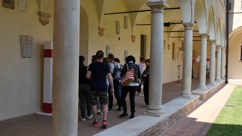 Ravenna Italy JUNE, 5, 2016 Tourists visit the portico of the cloister of the Franciscan monastery of Ravenna