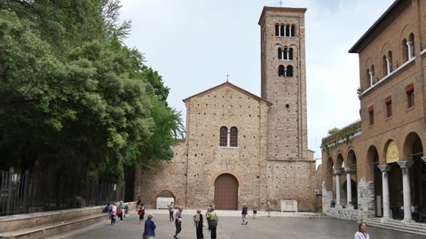 Ravenna Italy JUNE, 5, 2016 Facade of the Franciscan Basilica of San Francesco d'Assisi in Ravenna and the arcades