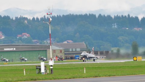 Zeltweg Austria SEPTEMBER, 6, 2019 Military aircraft take off with full afterburner power in a wet runway. Eurofighter Typhoon EFA of Austrian Air Force