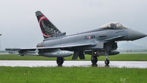 Zeltweg Austria SEPTEMBER, 6, 2019 Military jet airplane taxiing with special painted tail and opened air brake close up follow video. Eurofighter Typhoon EFA of Austrian Air Force