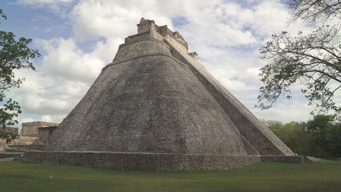 UXMAL, YUCATAN, MEXICO - CIRCA 2021: Pyramid of the Magician also known as the Piramide del adivino, one of the most recognizable landmarks of ancient Mayan city of Uxmal, Yucatan