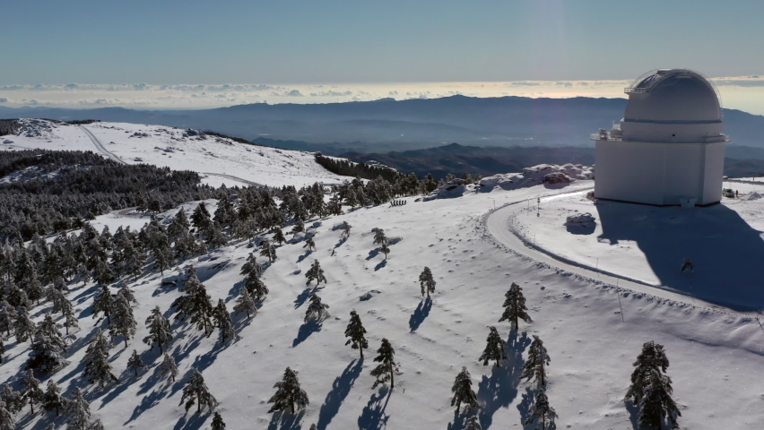 Aerial footage of astronomic observatory of Calar Alto after snowfall in Sierra de los Filabres Almeria Spain Royalty-Free Stock Footage #1079725652