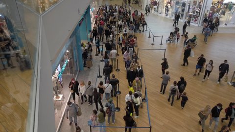 Europe, Italy, Milan September 2021 - Arese Shopping center Il Centro - Primark shop point of sale , people with mask after finish of lockdown due Covid-19 Coronavirus epidemic
