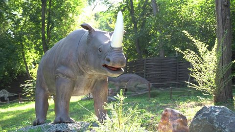 Dnipro, Ukraine - 09.09.2021: Exhibition of moving models animals from prehistoric period in Dinopark. Mechanical sculpture Ceratotherium Simum.