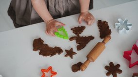 Cute little baby girl learning to cook traditional Christmas cookies in holiday Christmas decorated interior - Powered by Shutterstock - Get 15% off with code: PIKWIZARD15