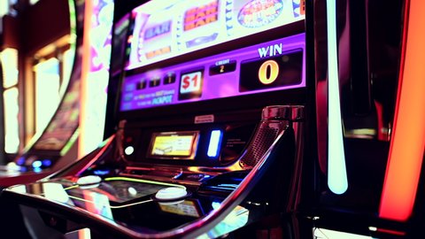 Gambling Theme. One Handed Bandit Slot Machine Bid and Spin in Las Vegas Casino. Caucasian Woman Playing Game.