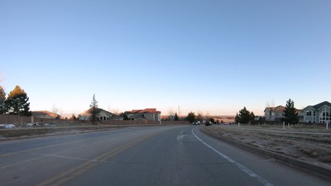 Denver, Colorado, USA-January 15, 2020 - Driving on typical paved roads in a suburban upscale residential neighborhood of America.