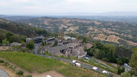 Saratoga , United States - 09 24 2021: Aerial around the mountain winery with a view of countryside of Saratoga in the background - orbit, drone shot	