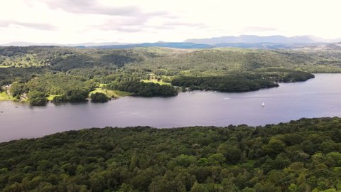 Panoramic View Of Windermere In The English Lake District With Boats In Water - aerial drone shot