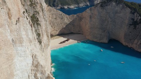 Tourists At Shipwreck Viewpoint, Offering Best View Of Navagio Beach With Remains Of MV Panagiotis In Greece. - aerial