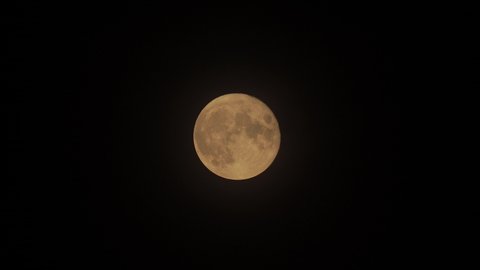Time Lapse of Harvest Moon September 21st 2021. Full Moonrise to upper right corner of frame. UK, North London, Night time.