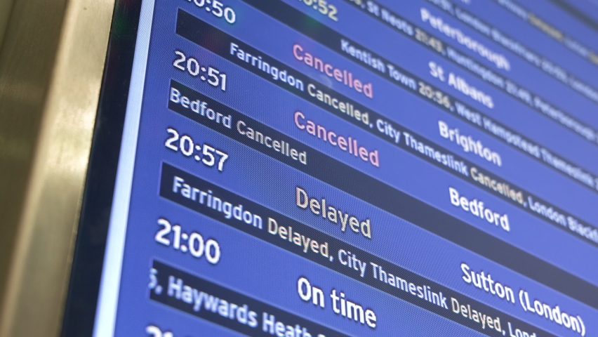Departure board showing cancelled and delayed train journeys from London St Pancras International station. Royalty-Free Stock Footage #1079773373