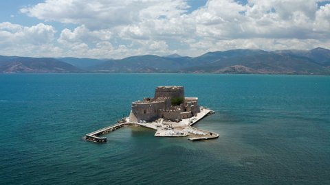 Bourtzi Fortress, a prison in the sea in front of Nafplio town the first capital of Greece - aerial drone shot