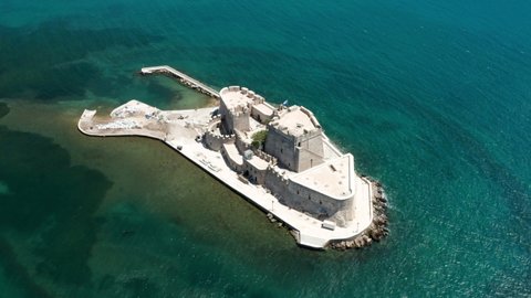 Water Castle Of Bourtzi In The Middle Of The Sea In Nafplio, Greece. aerial orbit