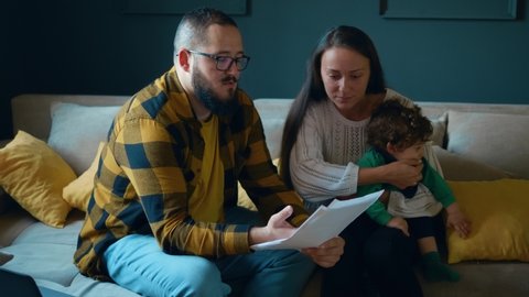 Frustrated married couple feeling stressed about high mortgage. Document loan refusal having financial problems debt. Couple having financial problems