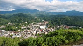 Aerial view of Gatlinburg with slow camera rotation. Gatlinburg is a popular mountain resort city in Sevier County, Tennessee, as it rests on the border of Great Smoky Mountains National Park.